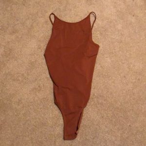 Burnt brown body suit with cut out back